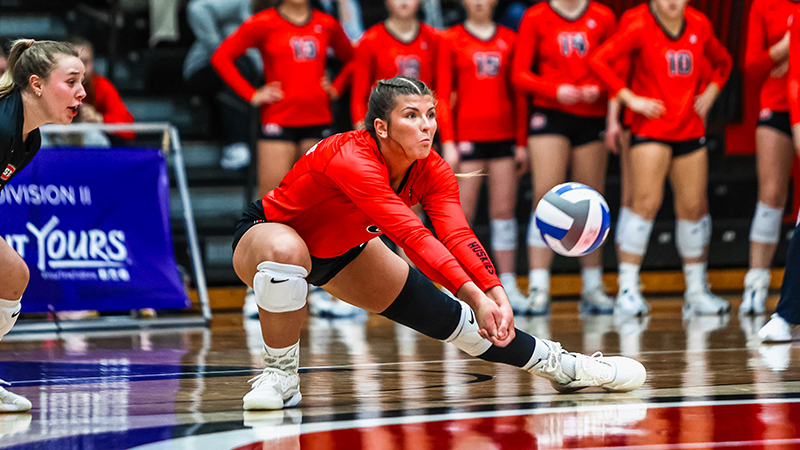 SCSU Volleyball player hitting ball