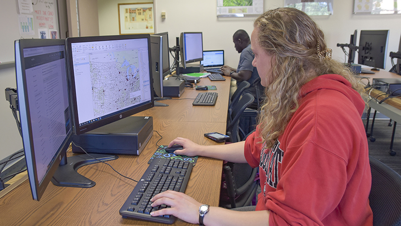 Two students working on GIS programming