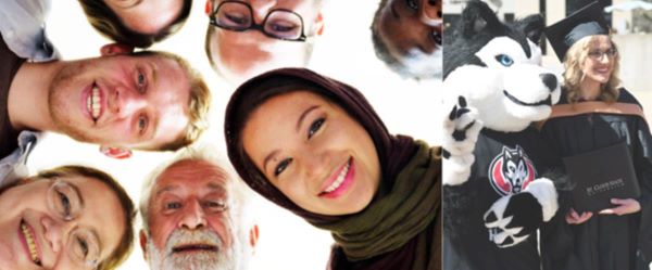 A circle of diverse faces looking down at camera and smiling
