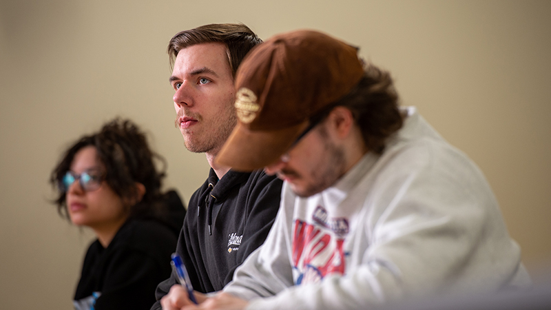Students listening to professor in business class