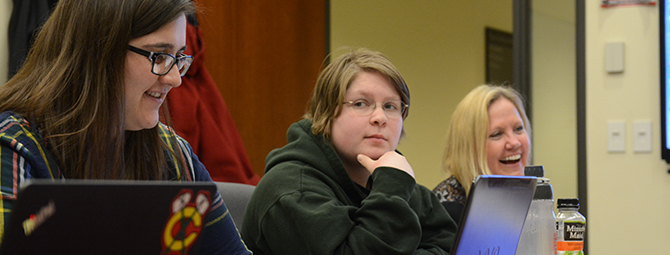 St. Cloud State history students discuss a class project. 