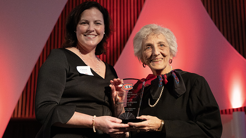 alumna receives alumni awards from Alumni Association Board president during last year's #OurSCSU gala