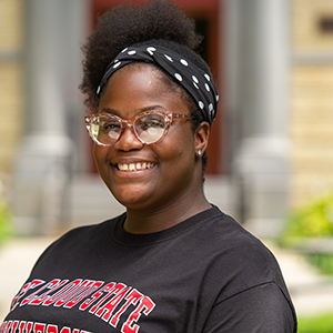 Student smiling at camera