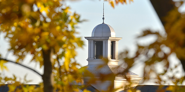 Campus cupola surrounded by trees in autumn