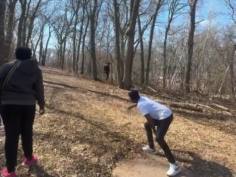 Student playing frisbee golf at Calvary Park in St. Cloud, Minnesota