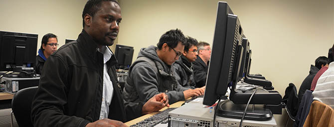 St. Cloud State students work at computers