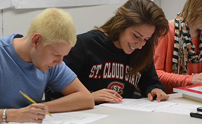 St. Cloud State students sit in class.