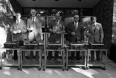 Participants get ready to cut the electronic ribbon at Kiehle rededication, September 1975