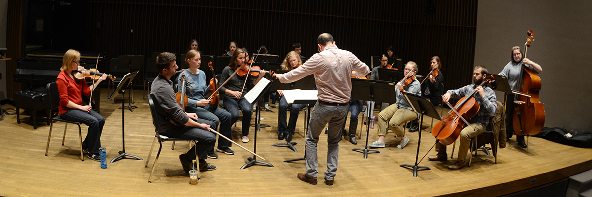 Chamber ensemble practicing on stage