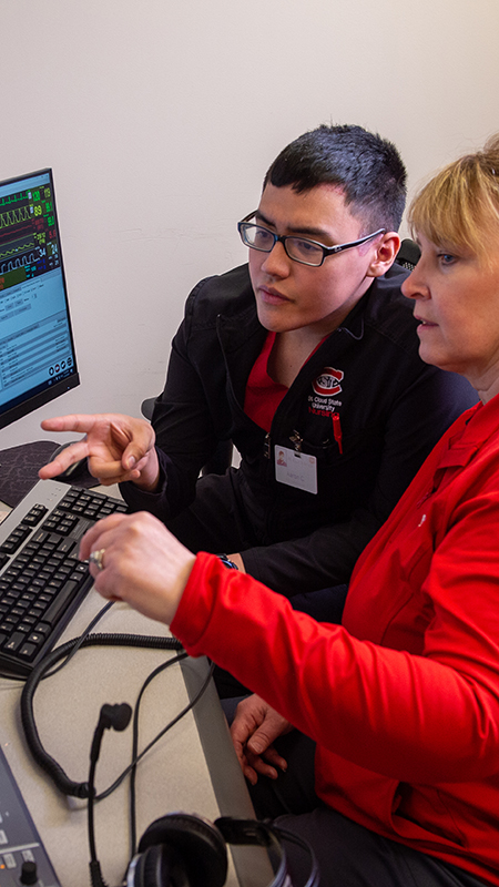 Nursing student and professor using an observation station