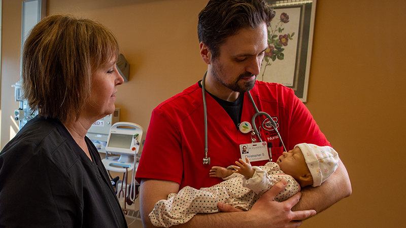 Nursing student learning about infants