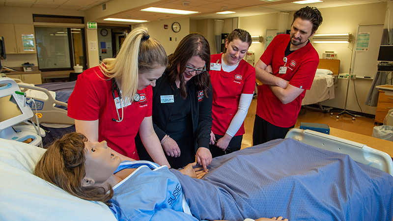 Nursing instructor at bedside