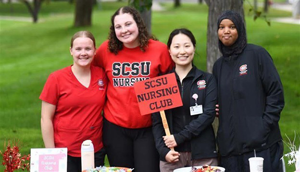Members of the SCSU Nursing club recruit at a student engagement event