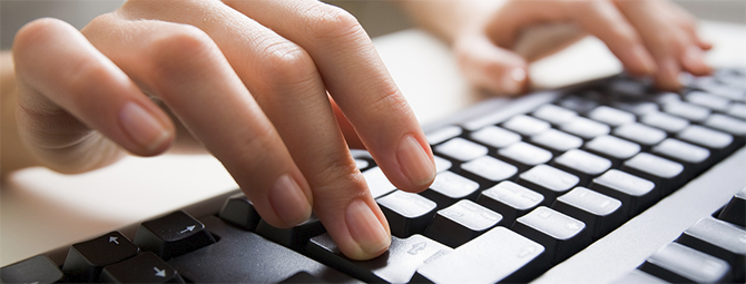 a user typing on a keyboard
