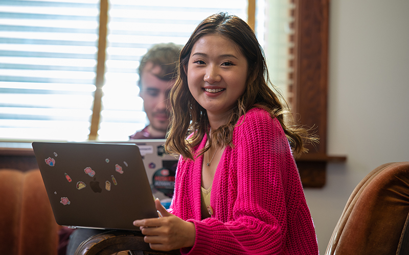 Student smiling at camera