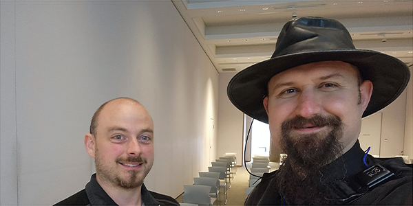 Professor Sinko with student, presenting in Japan