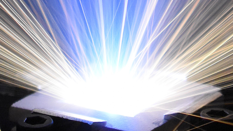 Bright light beaming out of laser ablation equipment