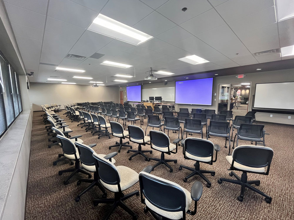 a back view of the auditorium showing rows of chairs