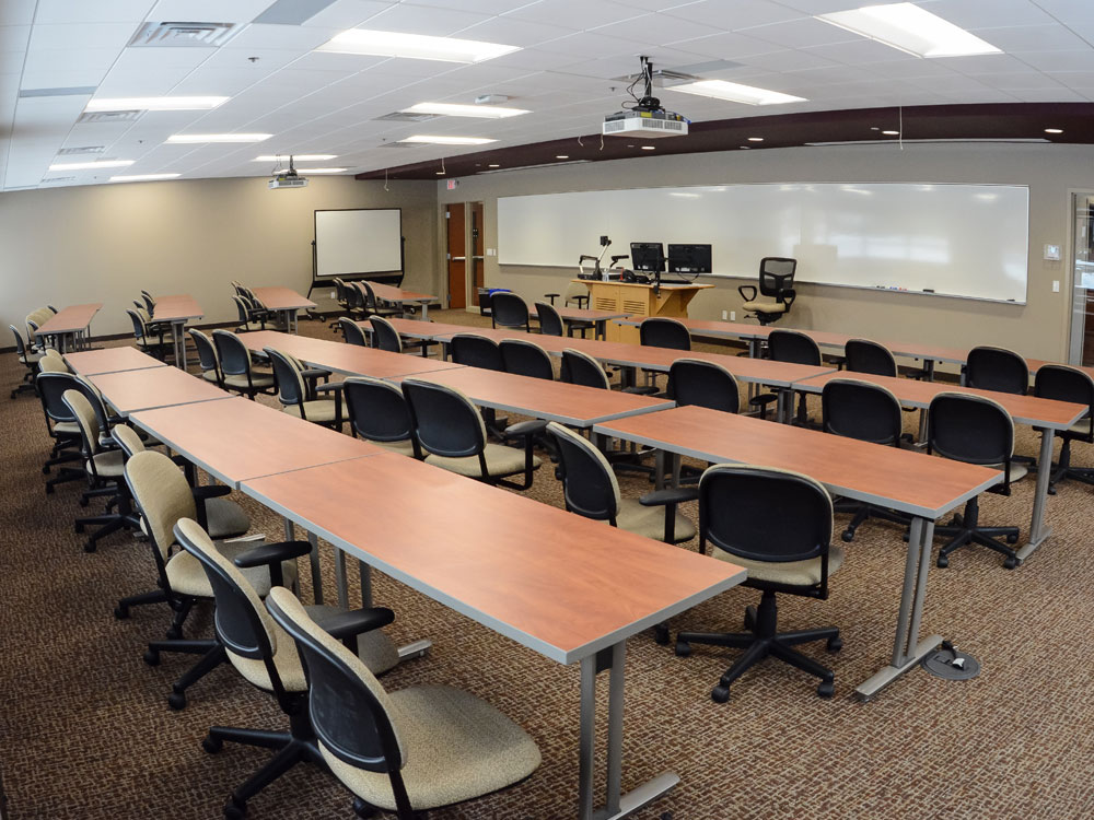 a back view of a classroom facing the whiteboard