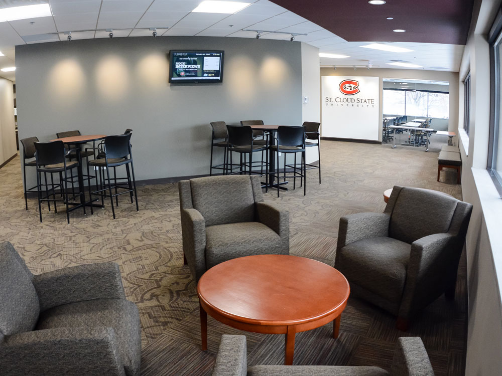 a view of the common area with tables and chairs