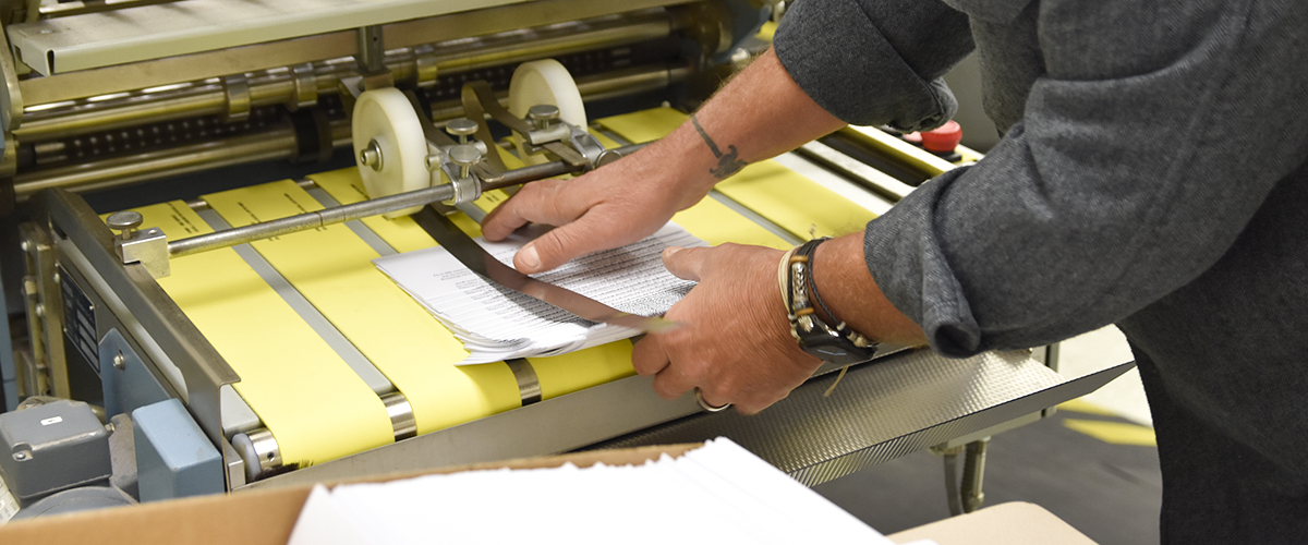 Letters coming out of a folding machine