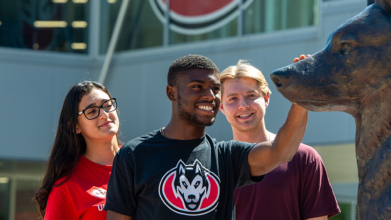 Students at Husky statue