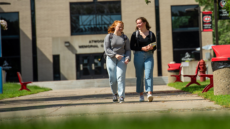 Students walking on sidewalk