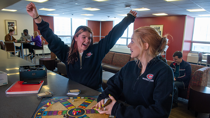 Winning board game in dorm lounge