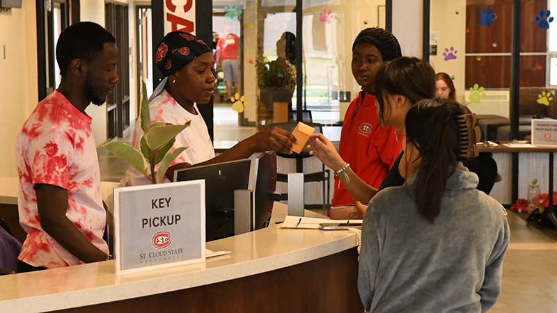 Picking up key at info desk