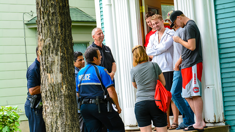 Mayor and police officers' neighborhood walk at student doorstep