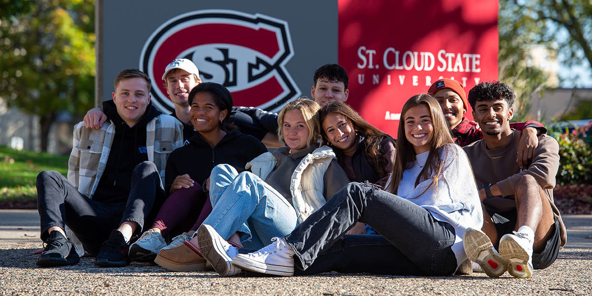 Group photo of students in front of SCSU sign