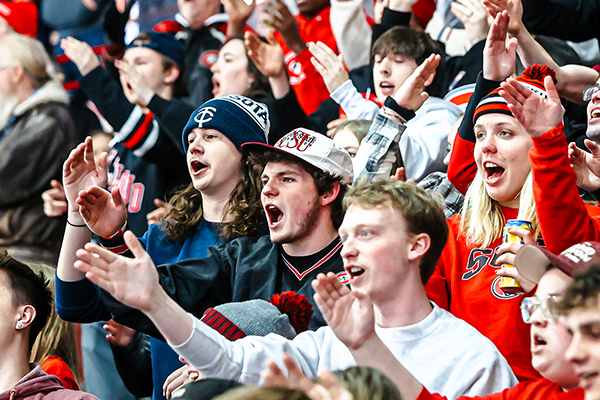 SCSU students cheering at a hockey game