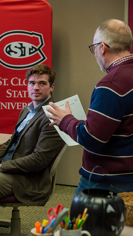 Student looking at faculty director