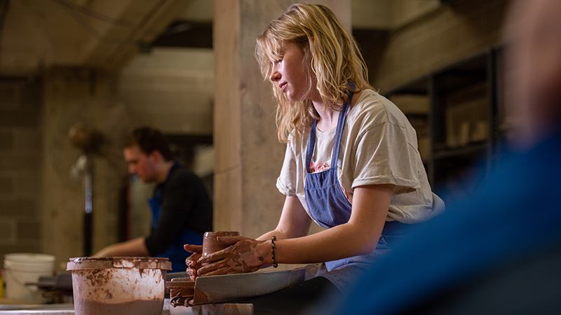 Pottery student