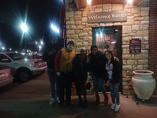 students from Project Connect - outside at restaurant
