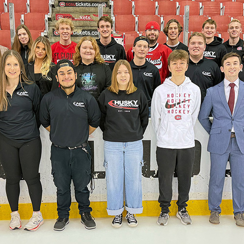Members of Husky Productions smile for a group photo