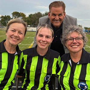 Mia Clark with other female soccer officials