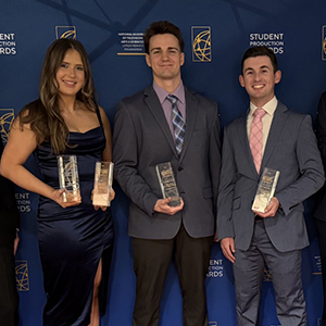 Members of the UTVS team hold up plaques received at student production awards ceremony 